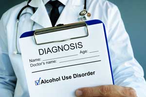 clipboard showing a diagnosis of alcohol use disorder