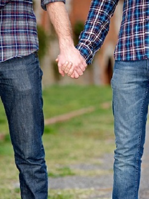 two men holding hands